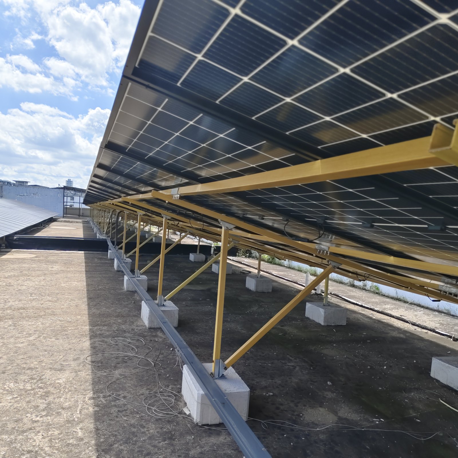 Composite supports installed under photovoltaic panels